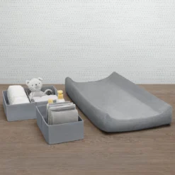 Delta Children 7-Piece Essential Changing Table Set - Newborn Baby Gift Set For Boys And Girls – Set Includes Changing Pad, Plush Changing Pad Cover, 3 Changing Pad Liners And 2 Storage Bins -Delta Children CP20103 5000 Essential Set Delta Callout 02