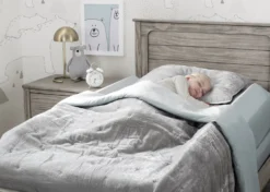 Delta Children Extra Long Foam Bedrail Bumper -Delta Children CR19002 5051SertaPerfectsleeperFoamBedrailRoomShotwithModel 86c5eaea 01b5 427d a0de c3a4c5acb2cb scaled